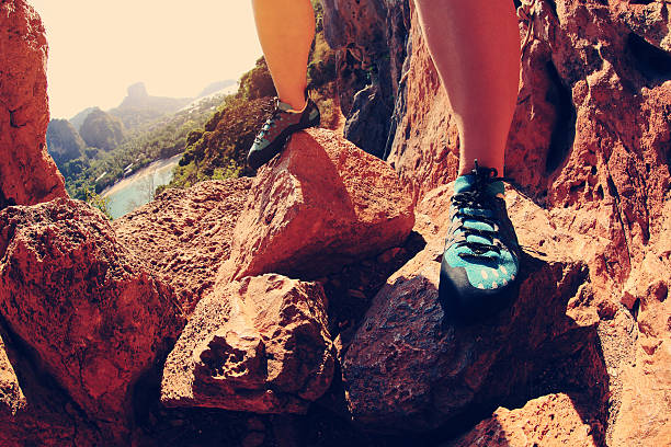 istock one young woman rock climber  on rock 528430446