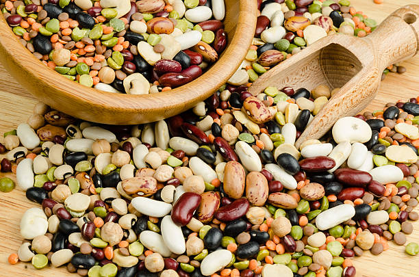 istock legumes on wood, closeup, background 528430773