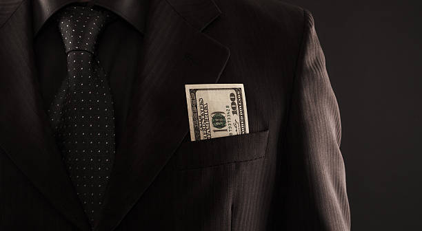 istock Businessman with one hundred dollars 528431104