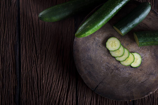 Fresh cucumber on the wooden table stock photo