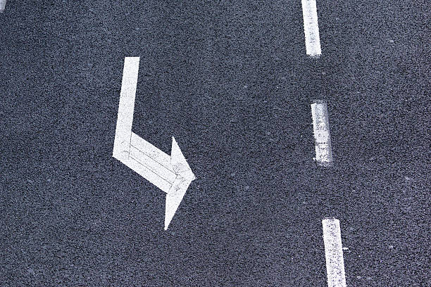 istock turning arrow on traffic lane 528431744
