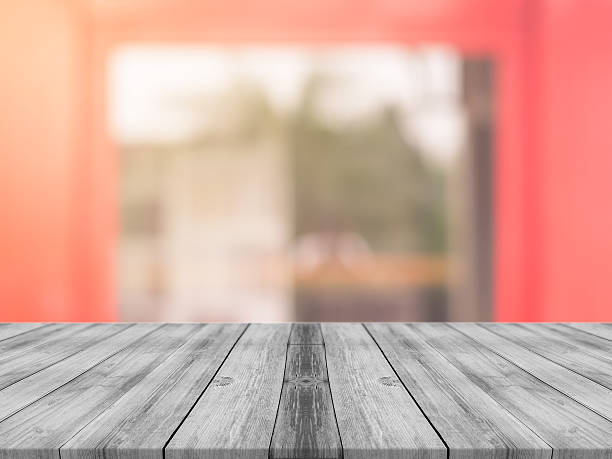 istock Wooden board empty table blur in coffee shop. 528436814
