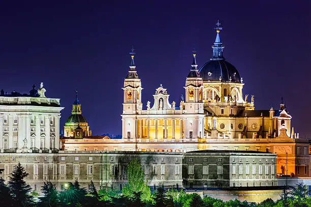 Madrid, Spain skyline at La Almudena Cathedral at night.