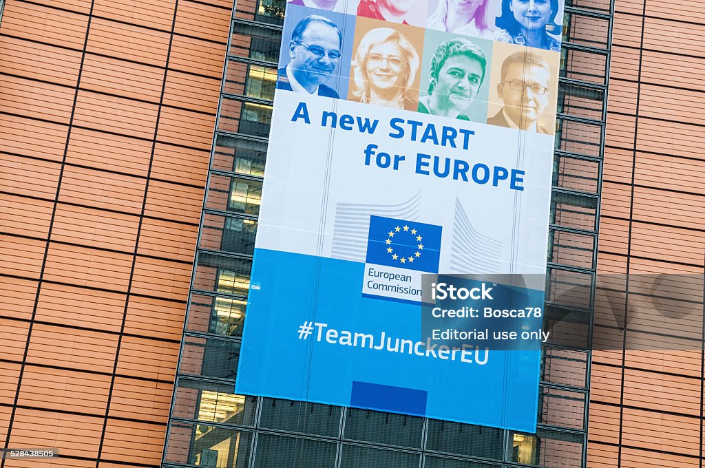 European Commision Team guided by Junker Brussels, Belgium - December 05, 2014: Banner showing components of the new European Commission team guided by Junker. The ads is standing on the facade of Berlaymont, building that host the European commission in Brussels, Belgium Architecture Stock Photo