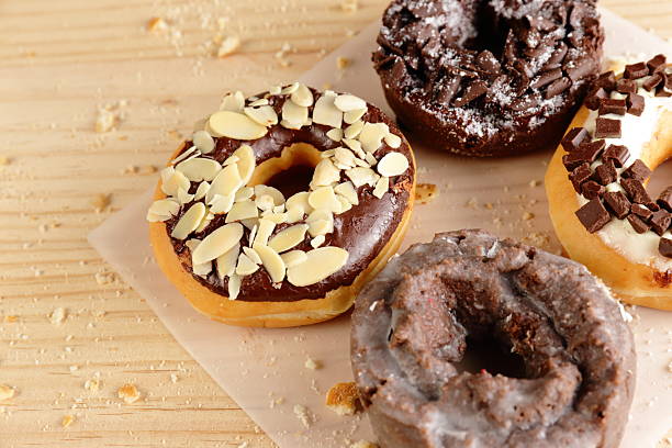 istock Donuts on wooden background 528438722