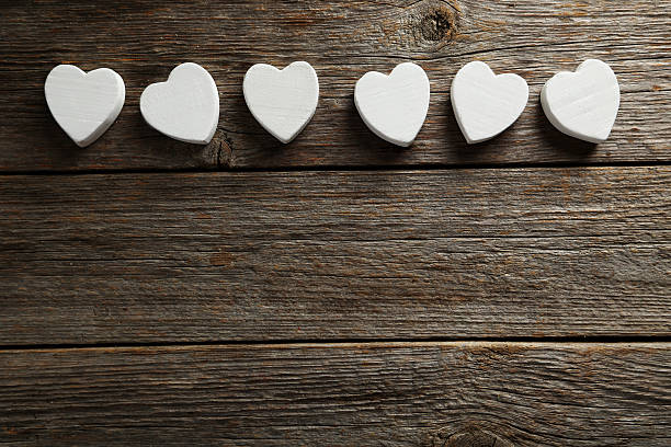 istock Love hearts on a grey wooden background 528438856