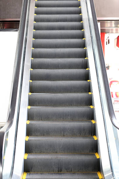 istock escalator in the Shopping mall. 528439581