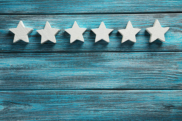 istock Decorative stars on a blue wooden background 528439674