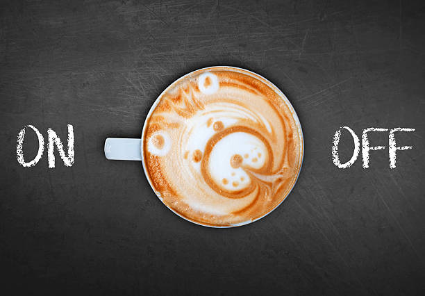 istock Cup of coffee on black board switching on 528439696