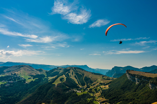 Paraglider flies over the Dolomites to infinity