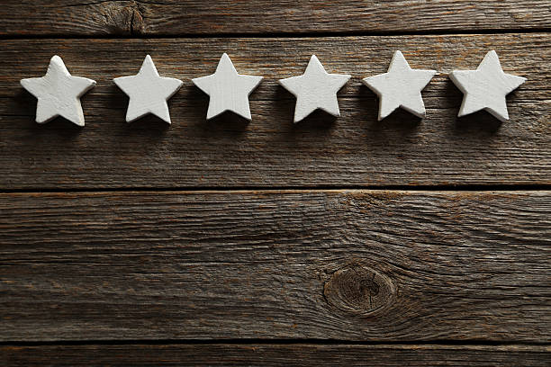 istock Decorative stars on a grey wooden background 528440442