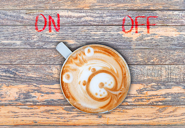 istock Cup of coffee on wooden board switching on 528440978