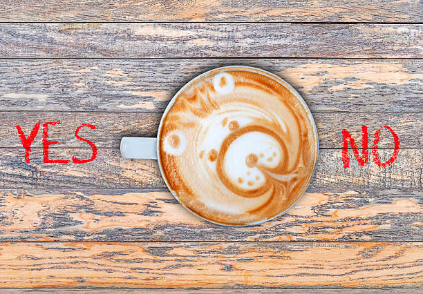 istock Cup of coffee on wooden board switching yes 528441112