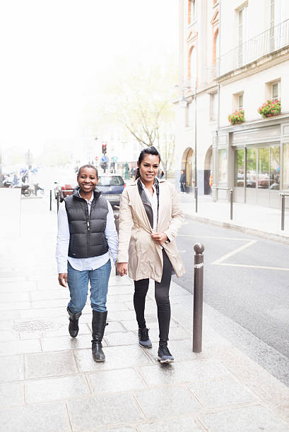 istock Women holding hands on Paris street 528441530
