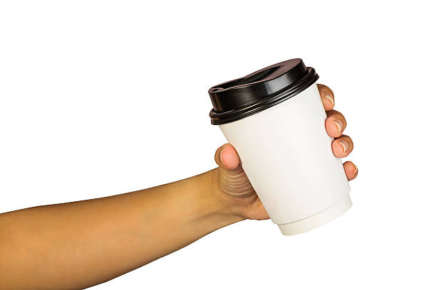 istock hand of woman holding a cup of coffee 528442795