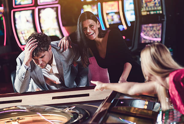 istock Friends playing roulette at the casino 528443226