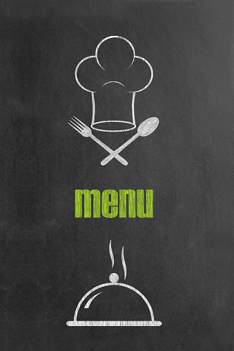 Chef's face with menu designed on blackboard.