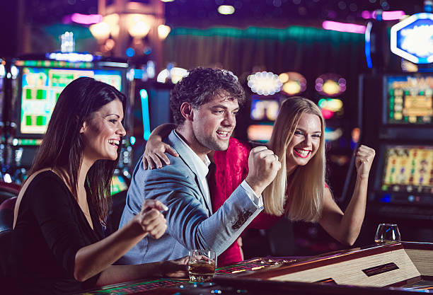 istock Friends playing roulette at the casino 528445416
