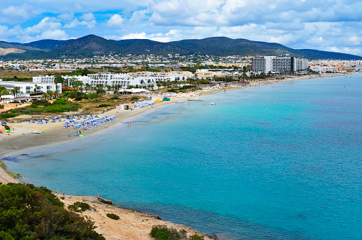 a panoramic view of the Platja den Bossa beach in Ibiza Town, in Ibiza Island, Balearic Islands, Spain