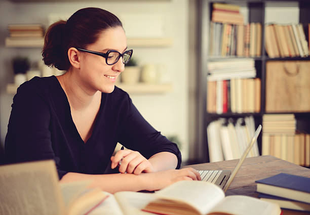 istock beautiful young woman working at home 528446396
