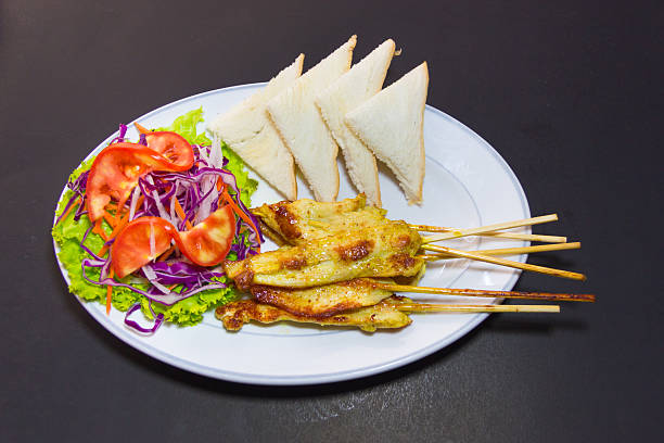 istock grilled pork satay with peanut sauce and vinegar on table 528462173