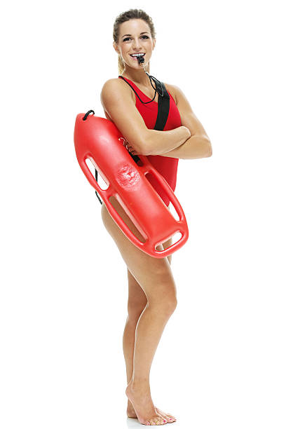 istock Female lifeguard with life buoy and whistle 528462995