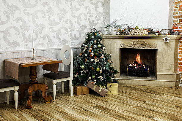 istock Decorated Christmas tree near fireplace 528464503