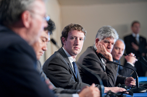 Deauville, France - MAY 26, 2011 : Facebook CEO Mark Zuckerberg participates to a conference about web technologies during the french G8 in the north of France with the Google CEO Eric Schmidt, Hiroshi Mikitani, founder of Rakuten, the Businessman in advertising Maurice Levy and the Orange CEO Eric Richard.