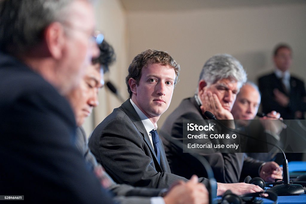 Mark Zuckerberg at G8 in Deauville, France Deauville, France - MAY 26, 2011 : Facebook CEO Mark Zuckerberg participates to a conference about web technologies during the french G8 in the north of France with the Google CEO Eric Schmidt, Hiroshi Mikitani, founder of Rakuten, the Businessman in advertising Maurice Levy and the Orange CEO Eric Richard. Mark Zuckerberg Stock Photo