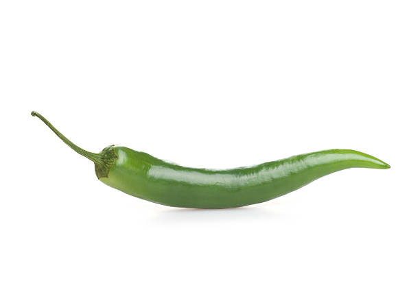 istock Green chili pepper isolated on white background 528467181