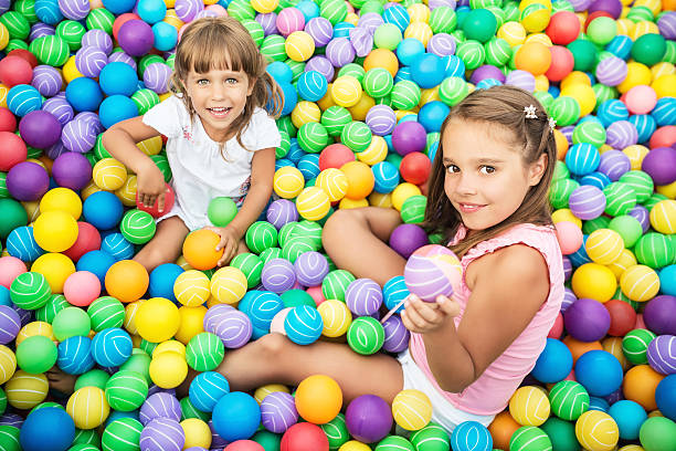 istock Girls in ball pool 528473892