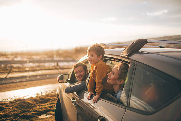 Making memories Photo of cute little family during their excursion with family car two parents stock pictures, royalty-free photos & images