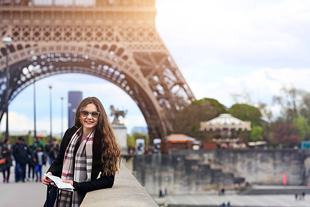 istock Young woman tourist smiling at Eiffel Tower Paris 528474106
