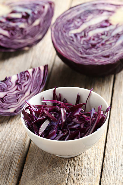 istock Ripe red cabbage on a grey wooden table 528475020