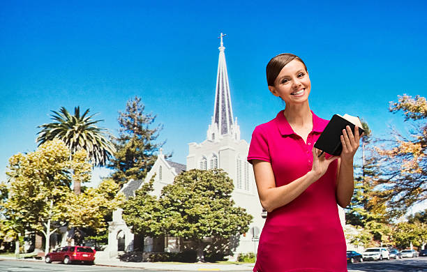 istock Smiling worshiper holding bible 528475426
