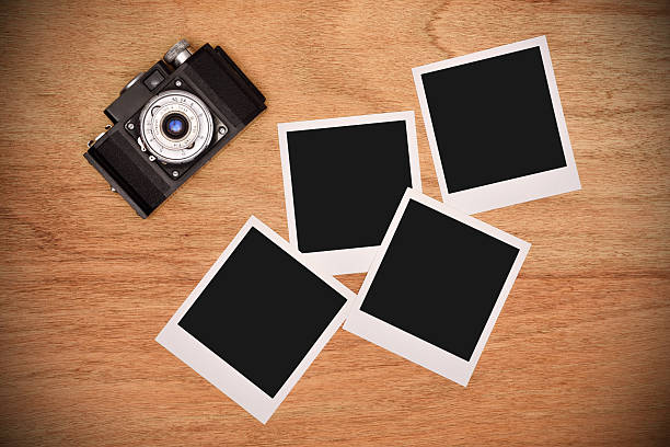 istock Vintage camera with blank photo 528477392