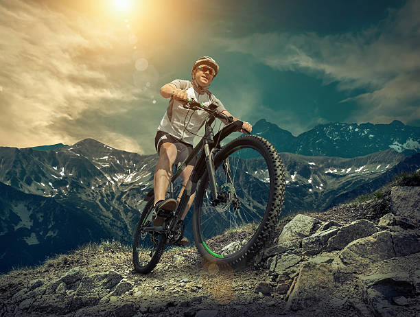 istock Man stay on the bicycle under sky with clo 528478578