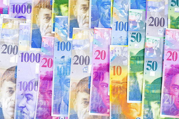 istock swiss francs lying on a white background 528479512