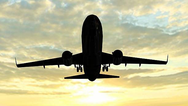 istock siluette of a modern passenger airplane takeoff in the sunset 528480624