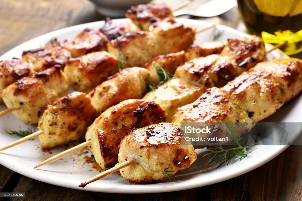Grilled chicken on bamboo skewers Grilled chicken on bamboo skewers, close up view Appetizer Stock Photo