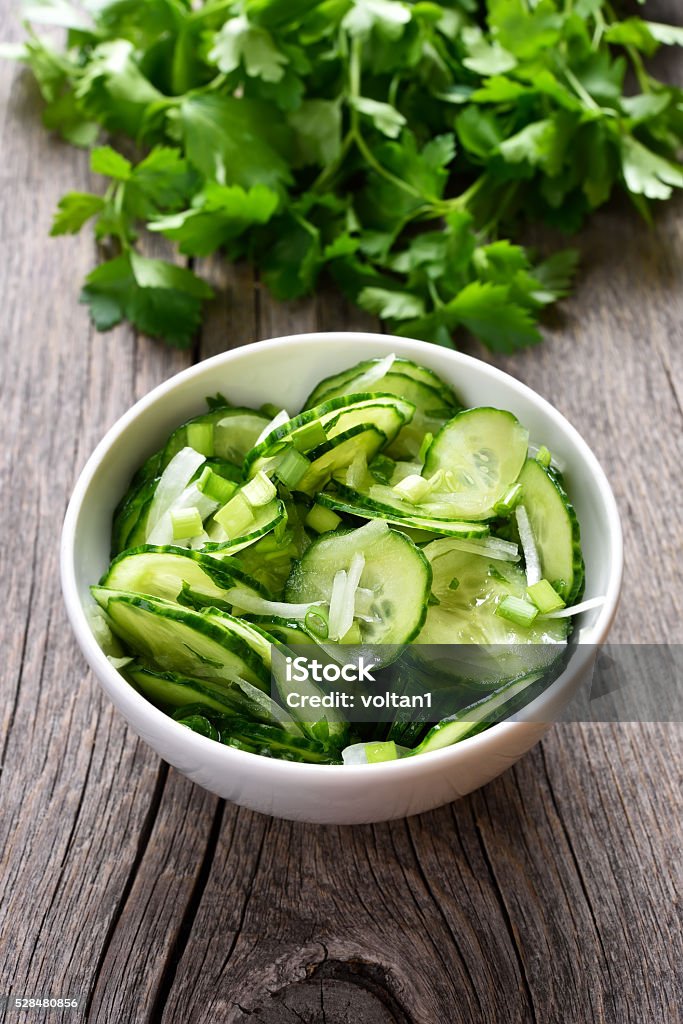 Cucumber salad on wooden background Green cucumber salad on wooden background Appetizer Stock Photo