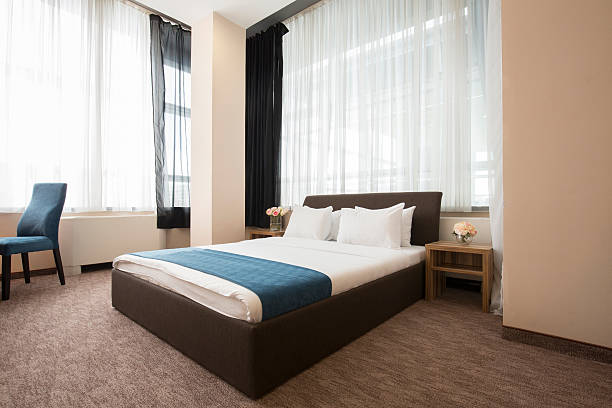 istock Elegant hotel bedroom interior 528481328