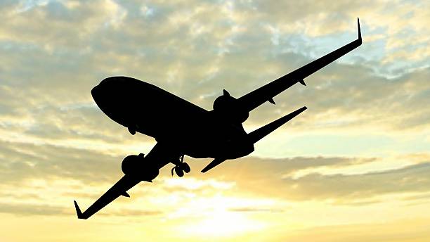 istock siluette of a modern passenger airplane takeoff in the sunset 528481682