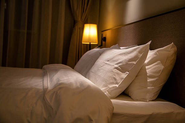 istock pillows and quilt on double bed at night 528482022