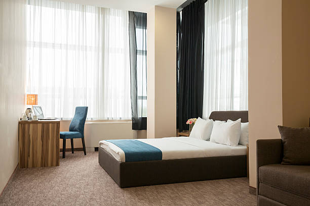 istock Elegant hotel bedroom interior 528482292