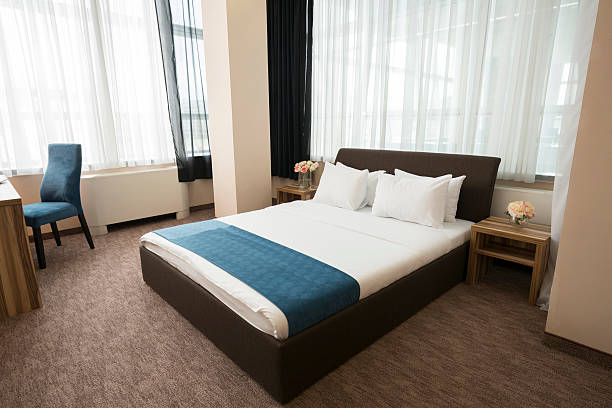 istock Elegant hotel bedroom interior 528482498