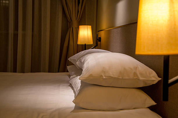 istock pillows and quilt on double bed at night 528483502