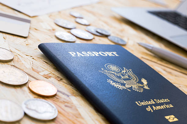 istock American passport and coins 528484106