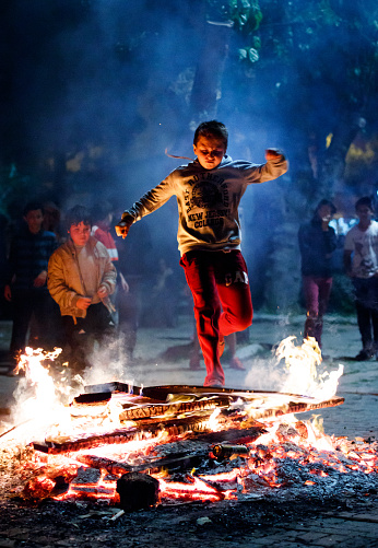 Izmir, Turkey - May 5, 2016: Hidirellez night. people have fun with jumping over the fire and making wishes. Hidirellez is celebrated as day on which prophets hizir and ilyas met on the earth at 5-6 May every year.