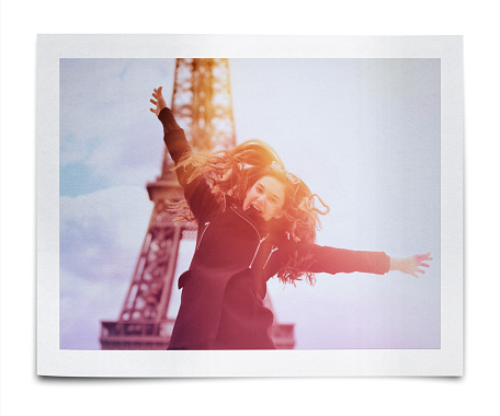 Girl jumping on the background of the Eiffel Tower, Paris, France (Clipping Path)